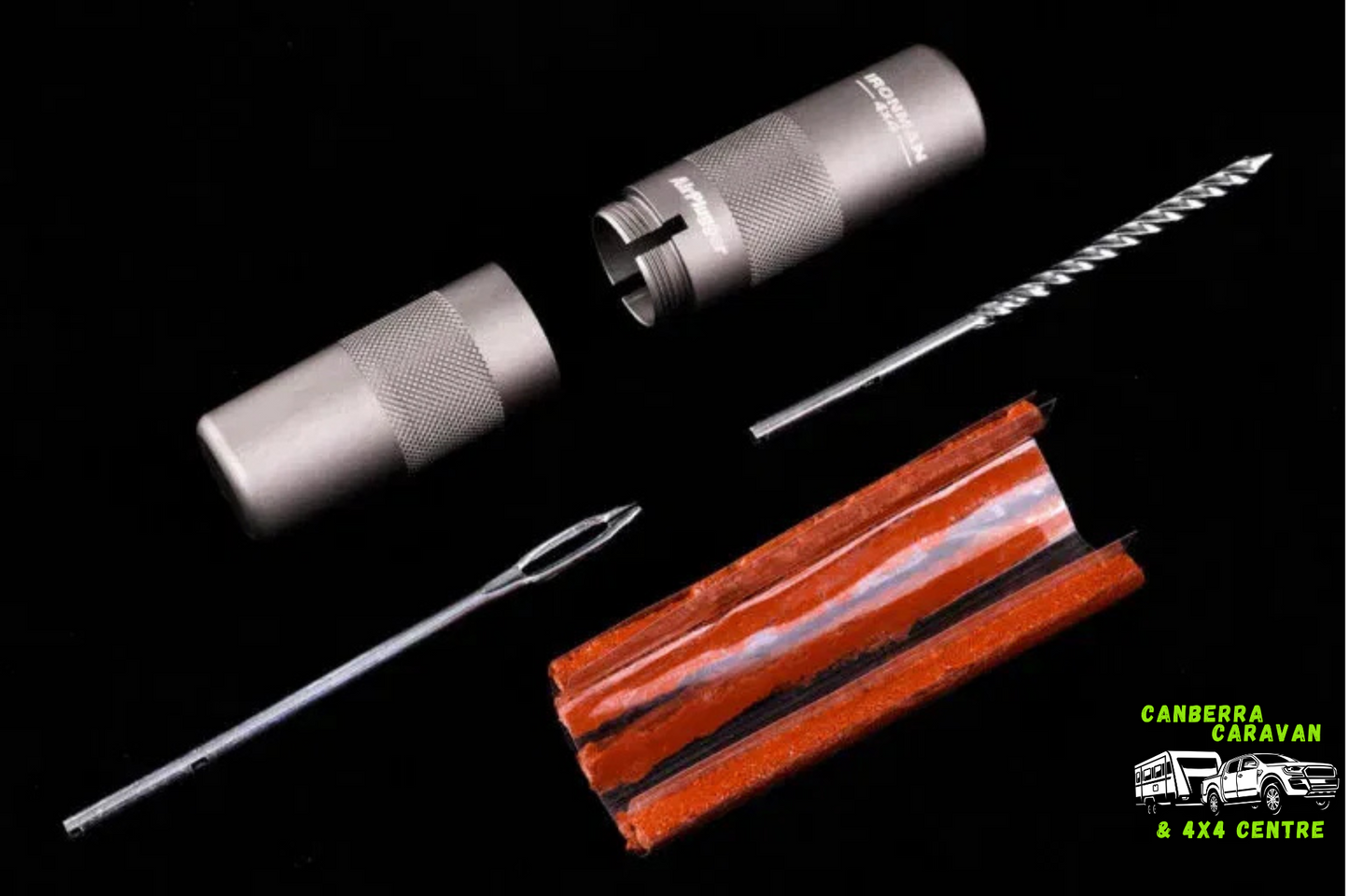 Set of tools including a metal rod, a rubber strip, and a small metal object on a black background with 'Canberra Caravan & 4X4 Centre' logo.